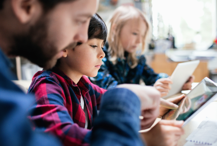 Boy reading book in special education class.