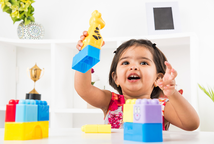 Toddler playing with legos