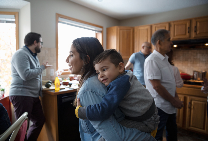 Family together in kitchen, showing three generations