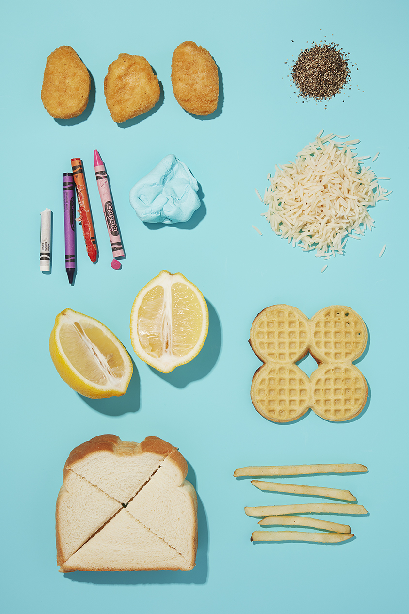 still life of various food and non food items on bright blue background