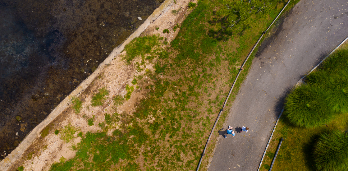 Photograph taken by drone shows Anthony ZAdor and his son running alongside the water.