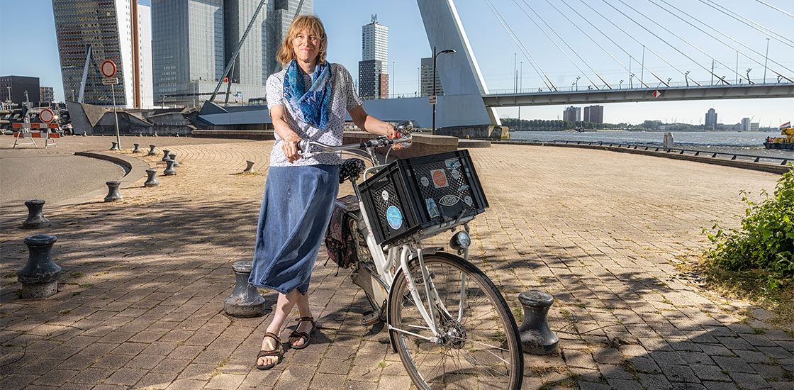 Portrait of Tonya White with her bike next to the water, Rotterdam.