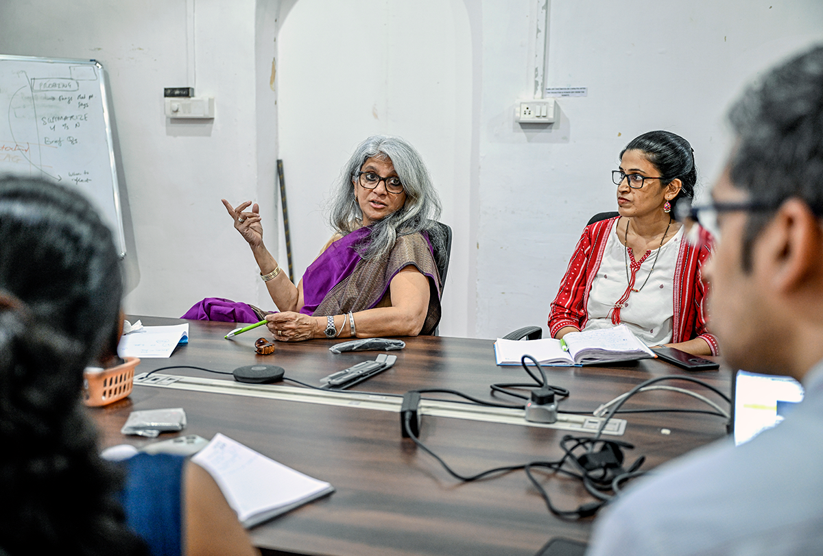 A photograph of Gauri Divan at a meeting