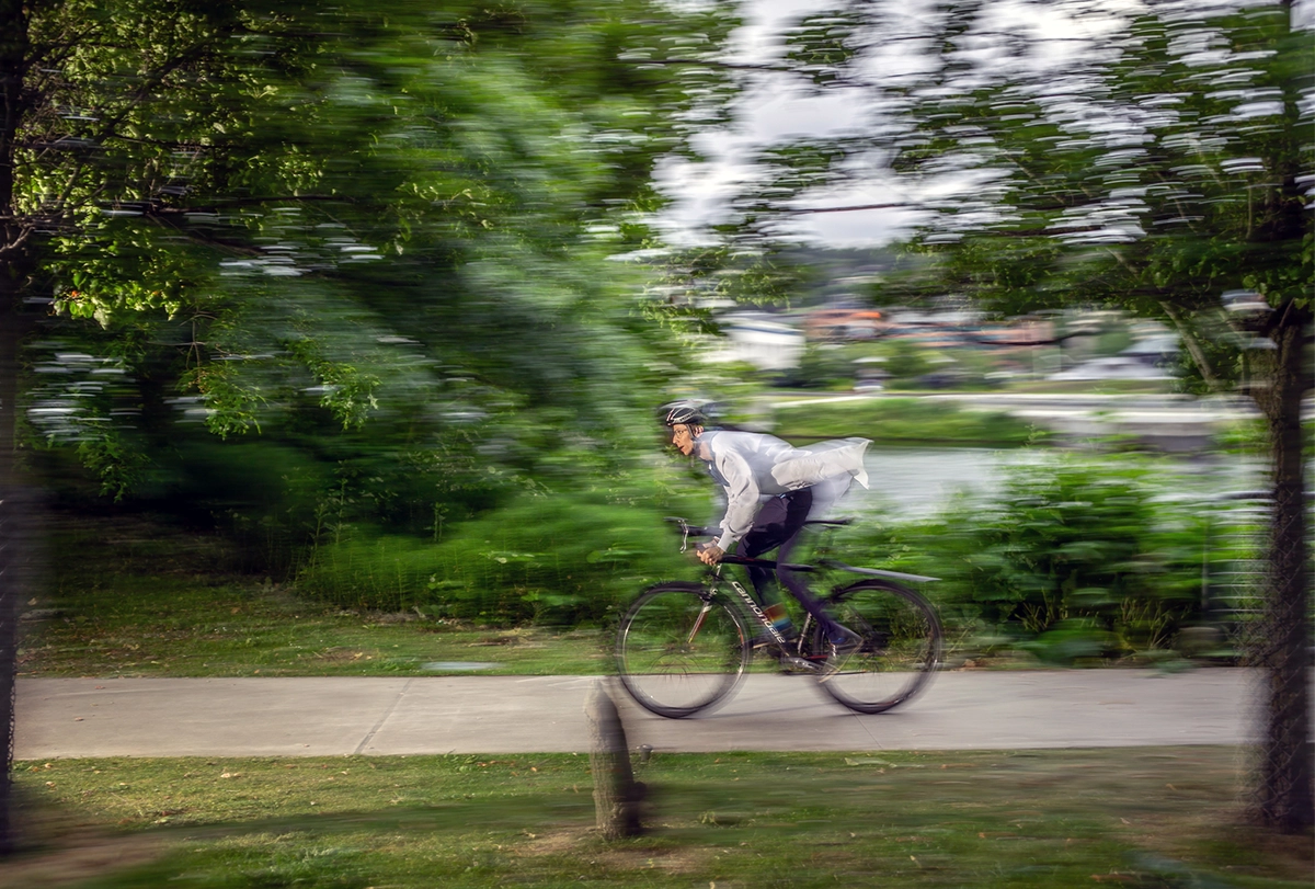 Photograph of Kaspar Podgorski riding a bike.