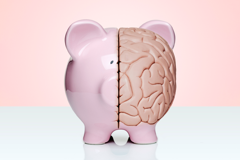 Piggy bank with half of its body replaced by a brain.