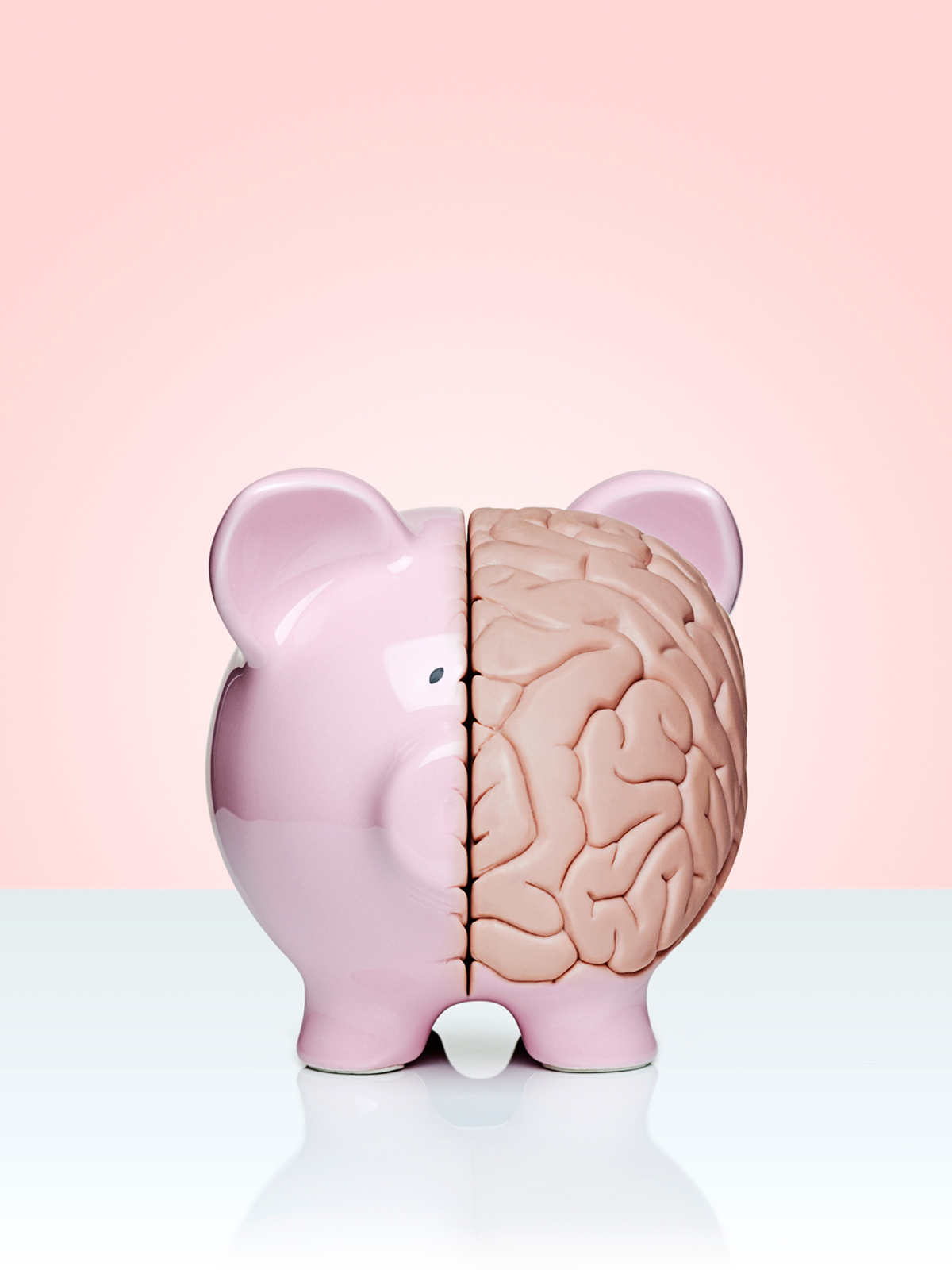 Piggy bank with half of its body replaced by a brain.