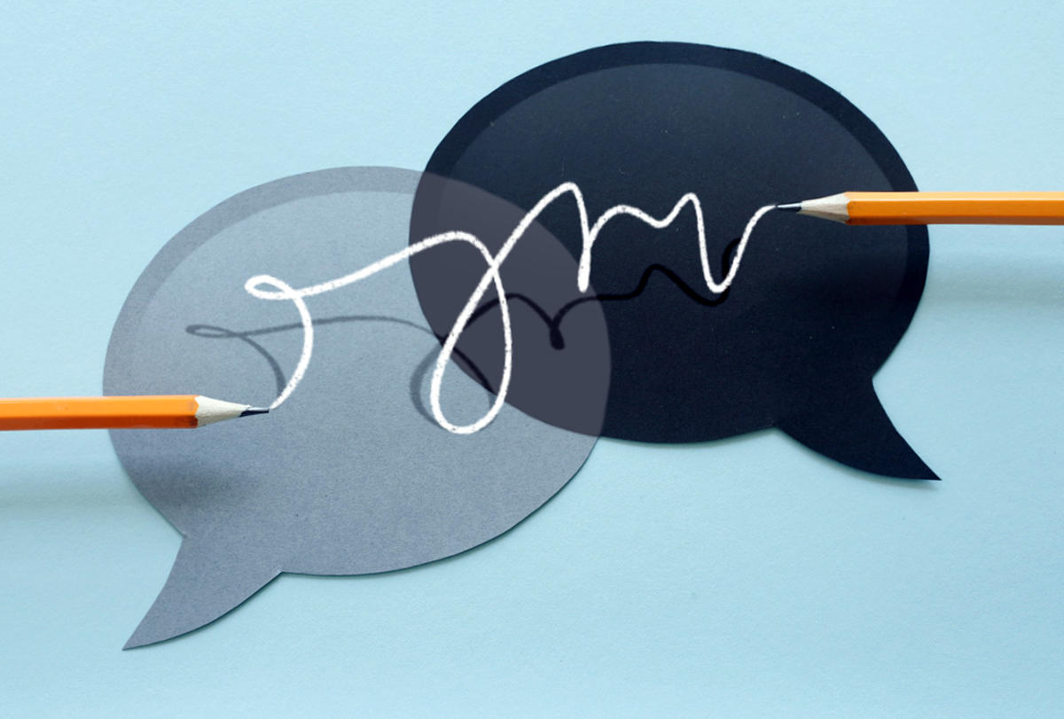 A curly line connects two pencils that are hovering over overlapping speech bubbles.