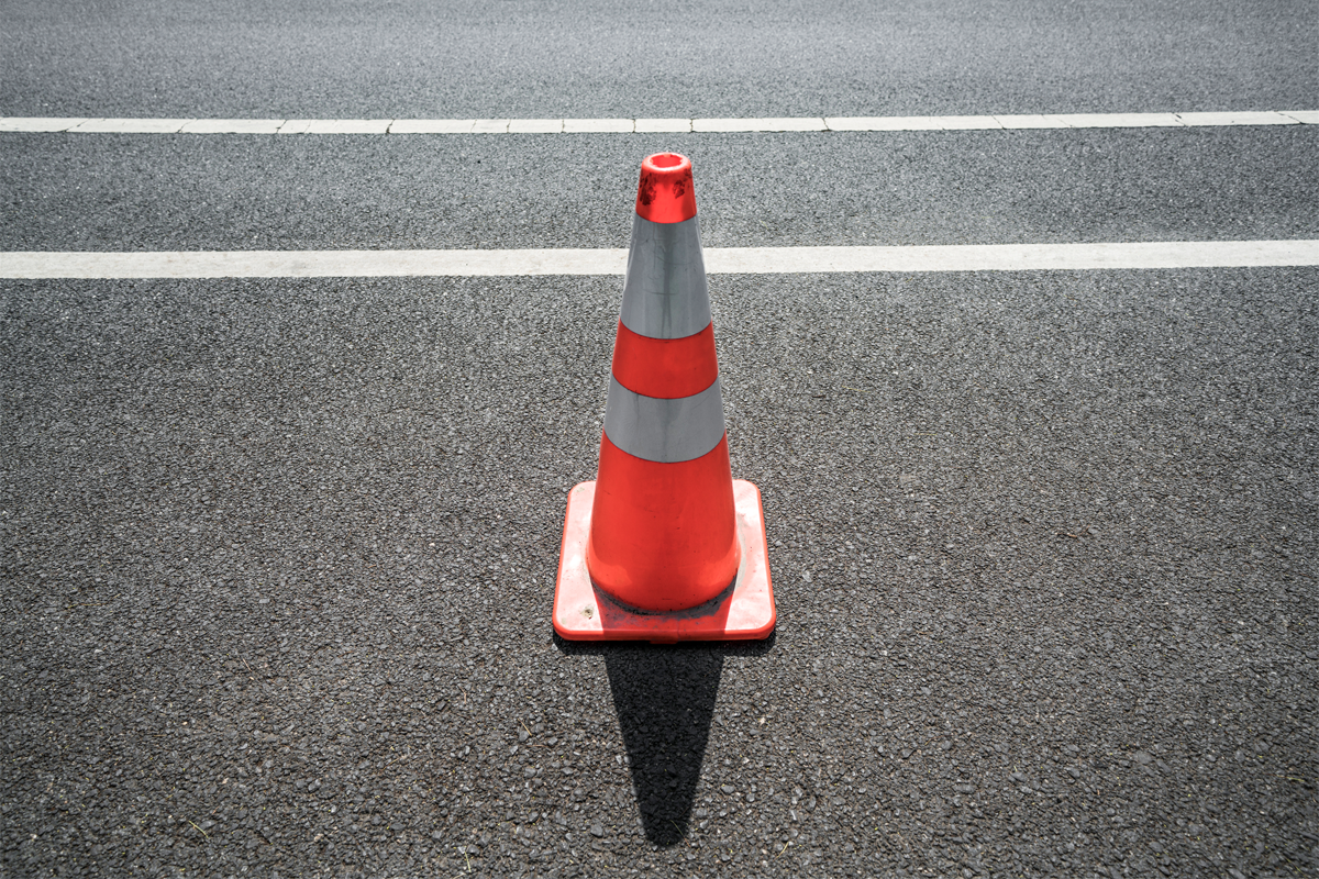 Traffic cone on a road.